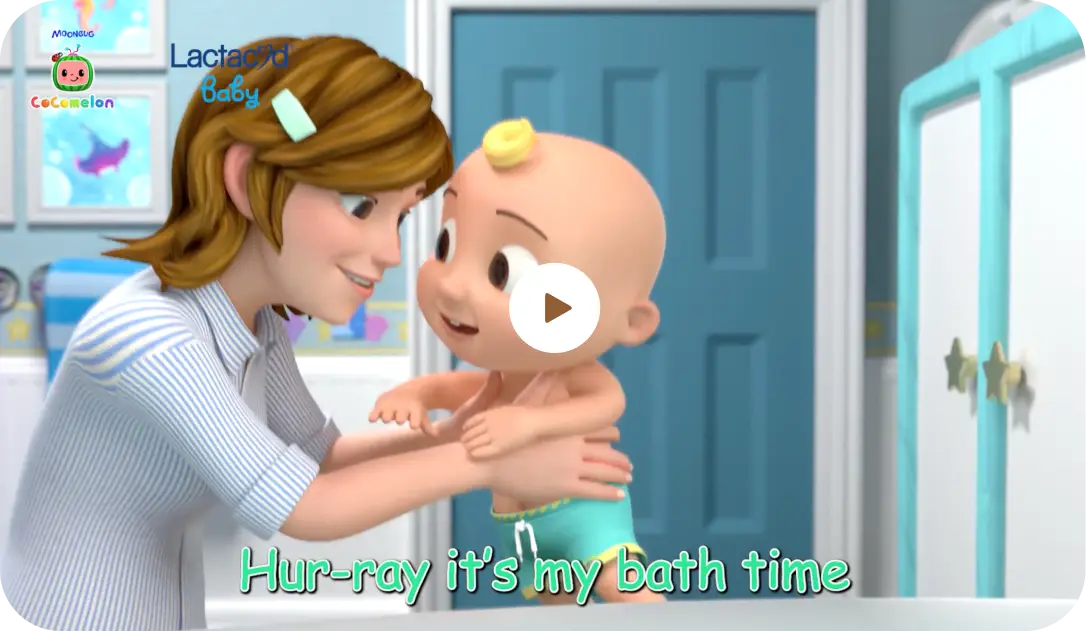 A smiling baby in a bathtub.
